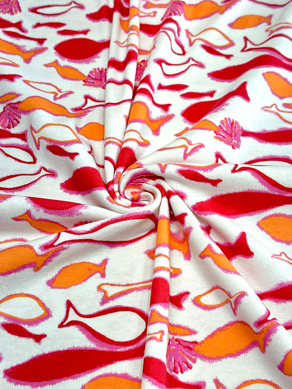 (COTTON BABY RIB) PINK, ORANGE AND RED FISH ON OFF WHITE