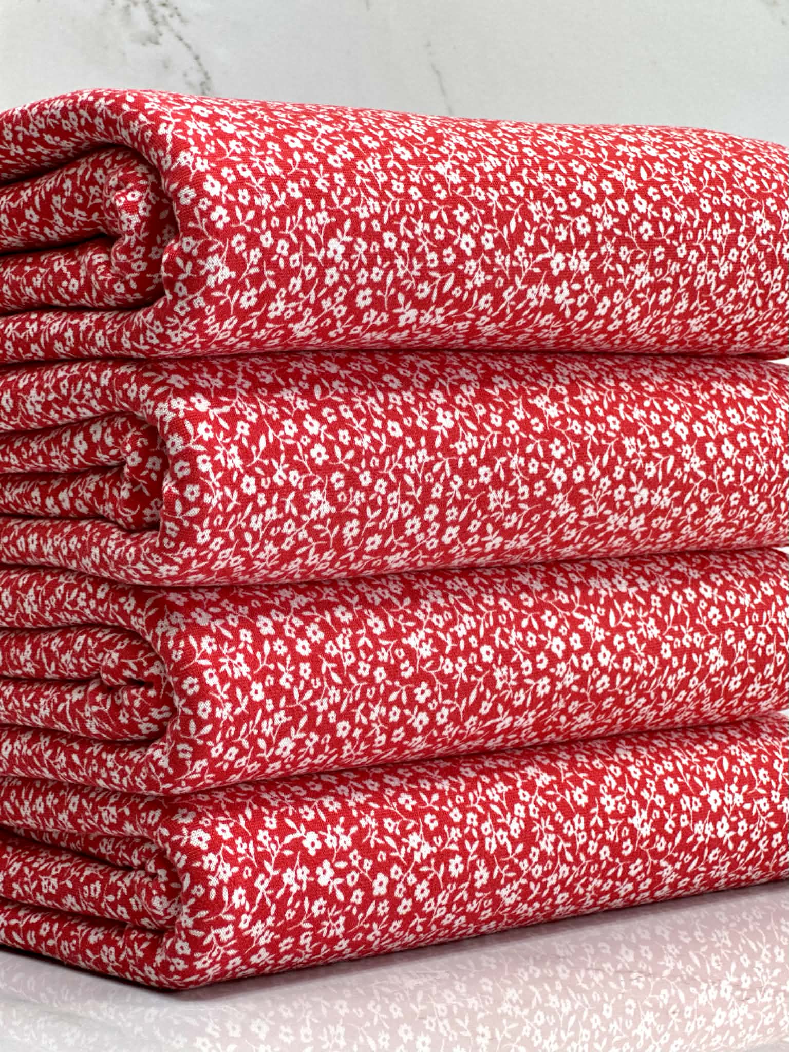 (DBP) TINY OFF WHITE FLOWERS ON RED(5)