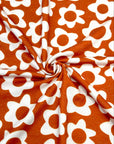 (FRENCH TERRY) IVORY DAISIES ON BURNT ORANGE