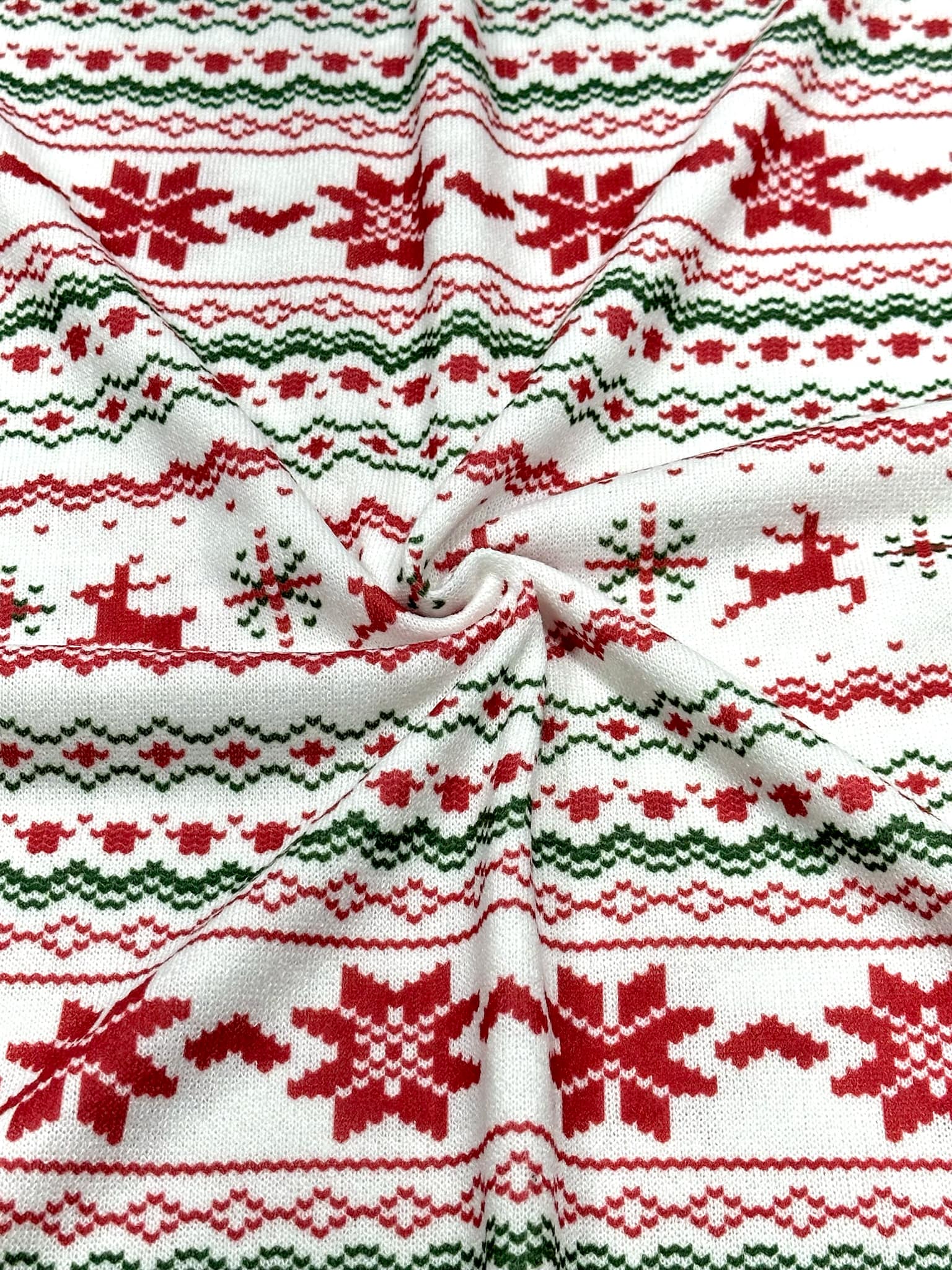 (SWEATER KNIT) RED REINDEERS AND RED POINSETTIA'S ON OFF WHITE