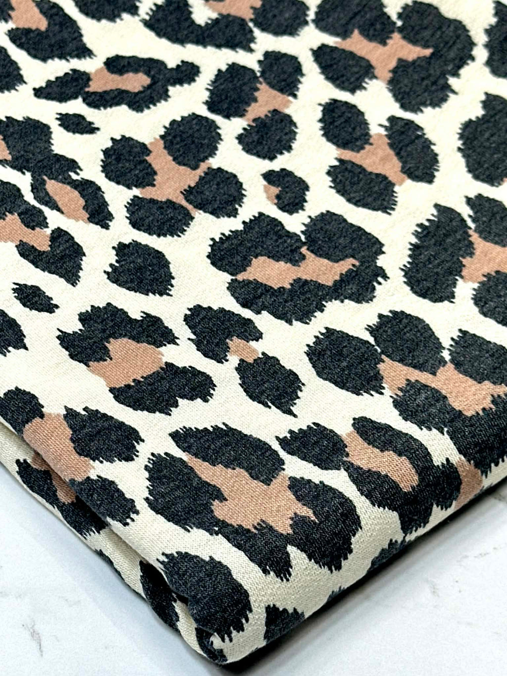 (FRENCH TERRY) BROWN AND BLACK CHEETAH ON CREAM