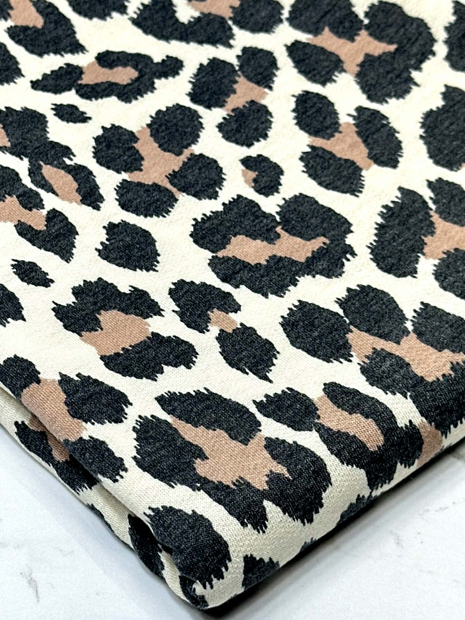 (FRENCH TERRY) BROWN AND BLACK CHEETAH ON CREAM