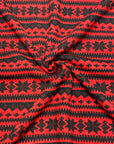 (SWEATER KNIT) SMALL BLACK POINSETTIAS ON SCARLET RED