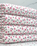 (FRENCH TERRY) PRETTY PINK SMALL FLOWERS AND TINY BLACK FLOWERS ON OFF WHITE