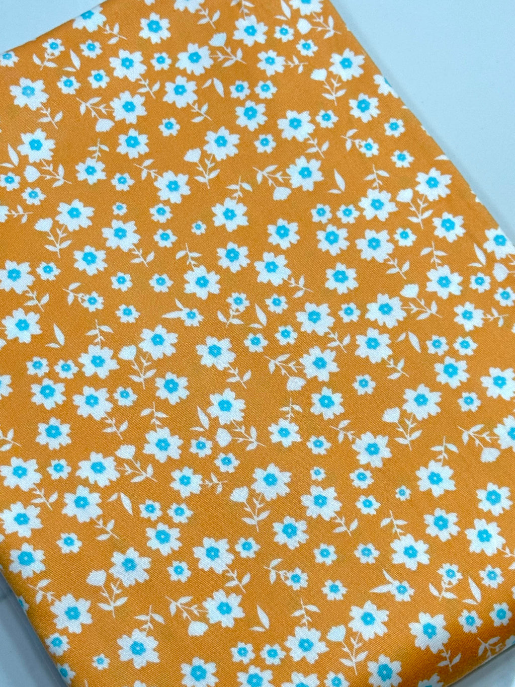 (DBP) TINY DARK MINT AND OFF WHITE FLOWERS ON ORANGE
