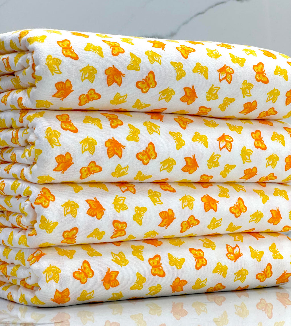(COTTON SPANDEX) SMALL YELLOW AND ORANGE BUTTERFLIES ON OFF WHITE