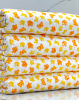 (COTTON SPANDEX) SMALL YELLOW AND ORANGE BUTTERFLIES ON OFF WHITE