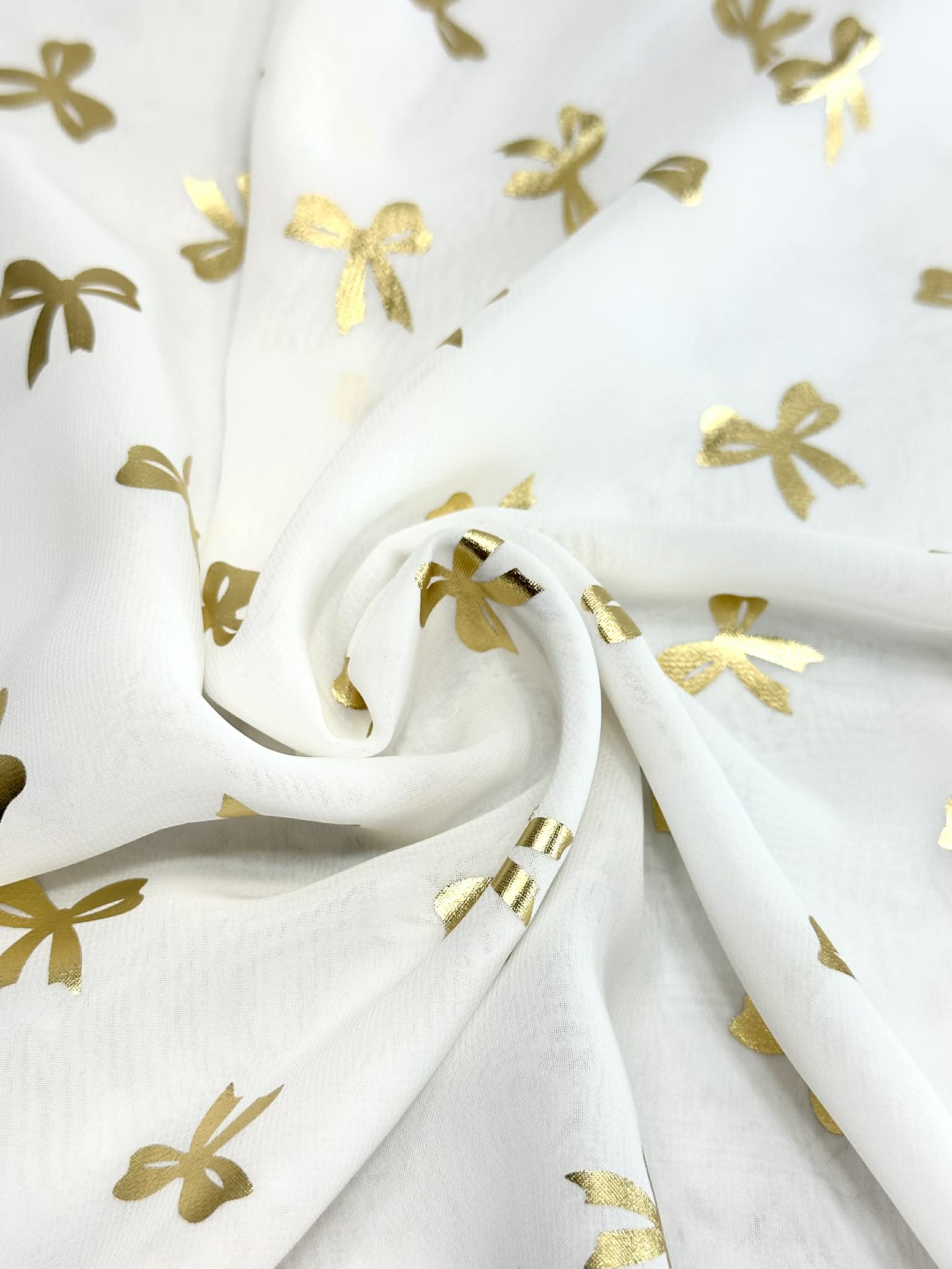 (WOVEN) GOLD BOWS ON OFF WHITE