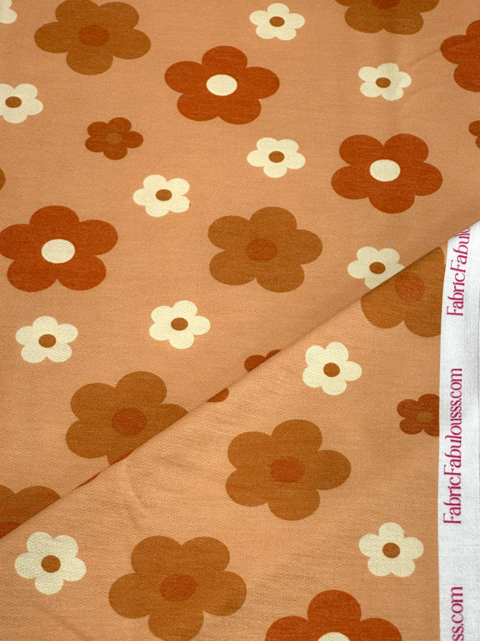 (FRENCH TERRY) RUST, BURNT ORANGE AND OFF WHITE DAISIES ON LIGHT ORANGE (1)