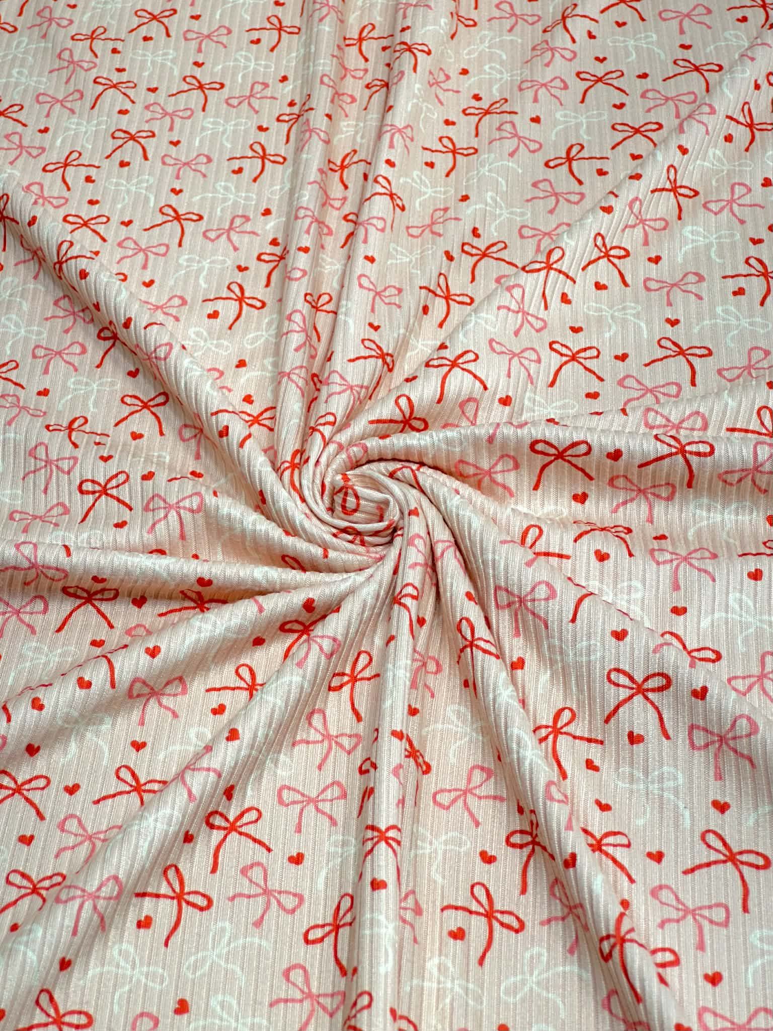 (4X2 YUMMY RIB) RED, PINK, AND IVORY BOWS WITH TINY HEARTS ON LIGHT BLUSH (3)