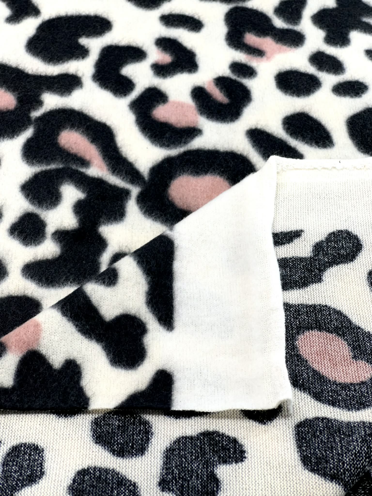 (BRUSHED SWEATER KNIT) BLACK AND CORAL CHEETAH ON OFF WHITE