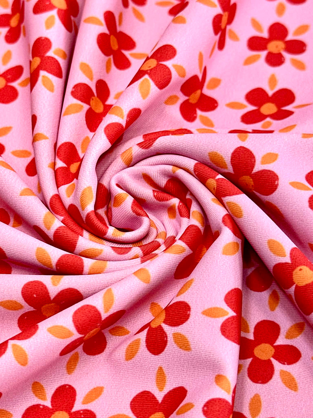 (SWIM) RED AND ORANGE FLOWERS ON PINK