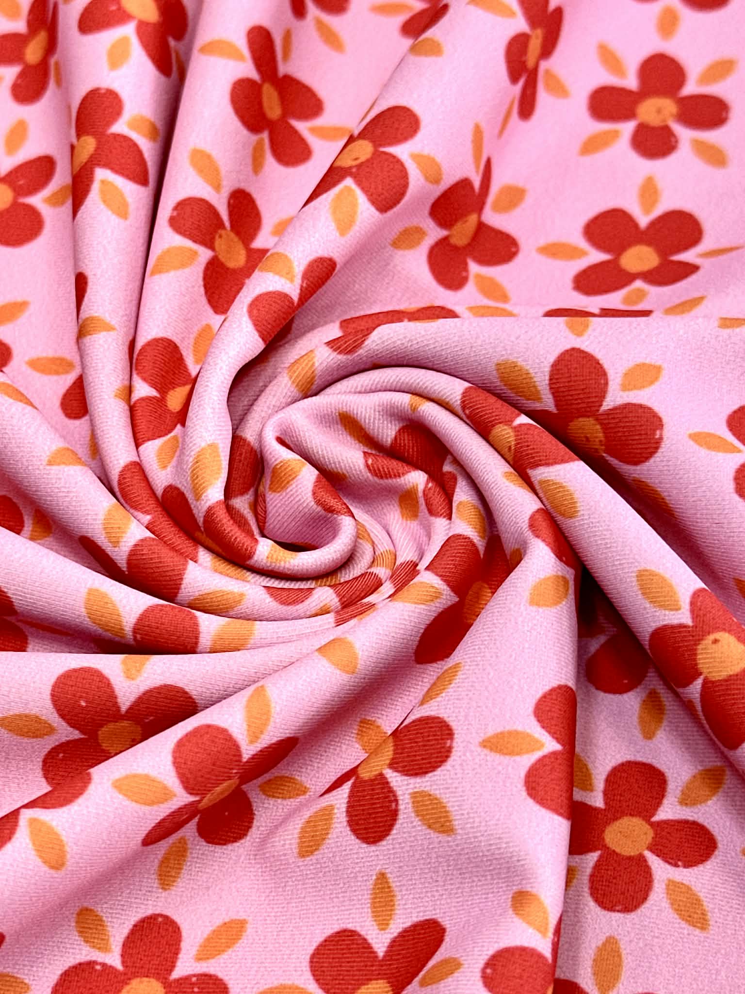 (SWIM) RED AND ORANGE FLOWERS ON PINK
