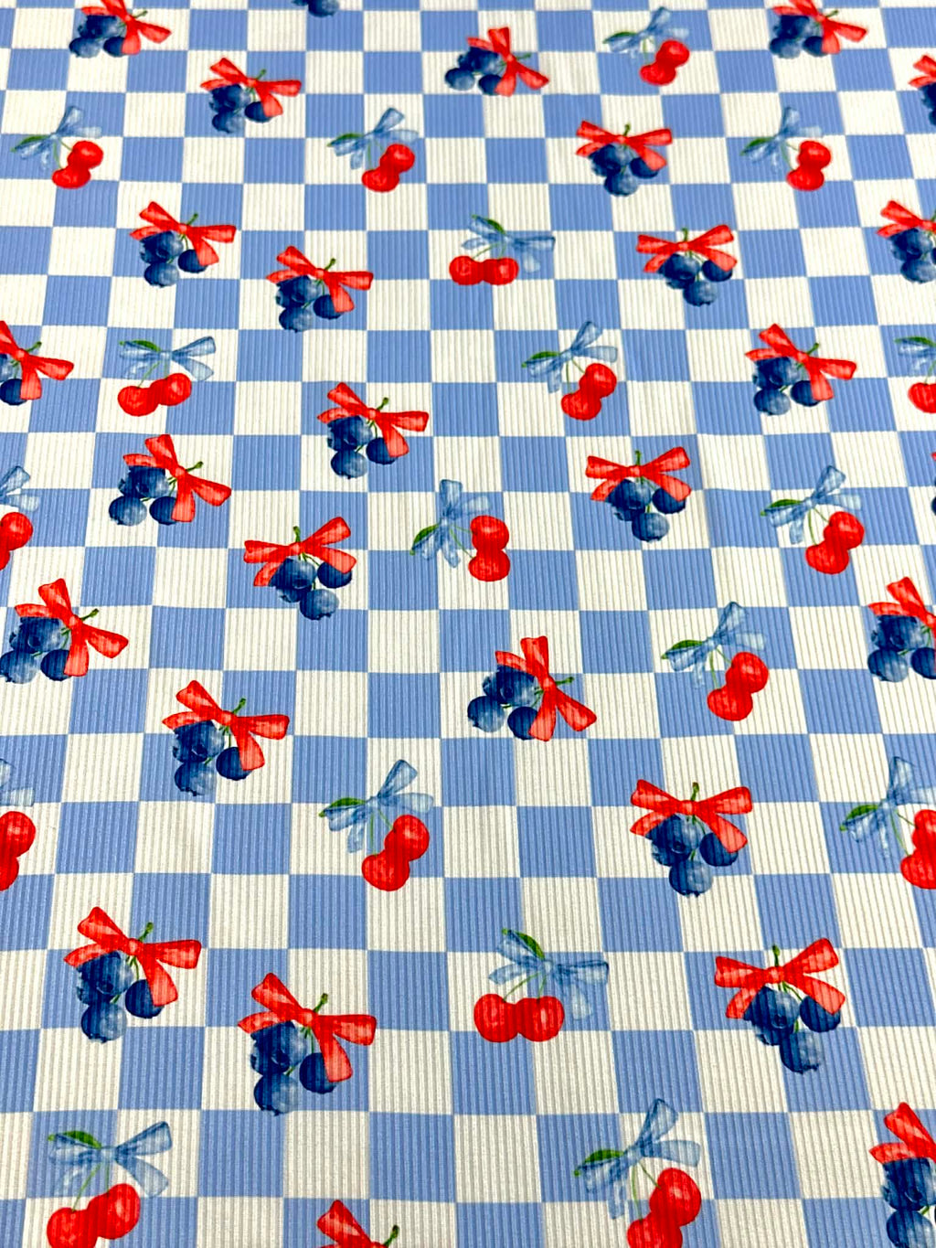 (2X2 YUMMY RIB) CHERRIES AND BLUEBERRIES WITH BOWS ON BLUE AND OFF WHITE CHECKERED