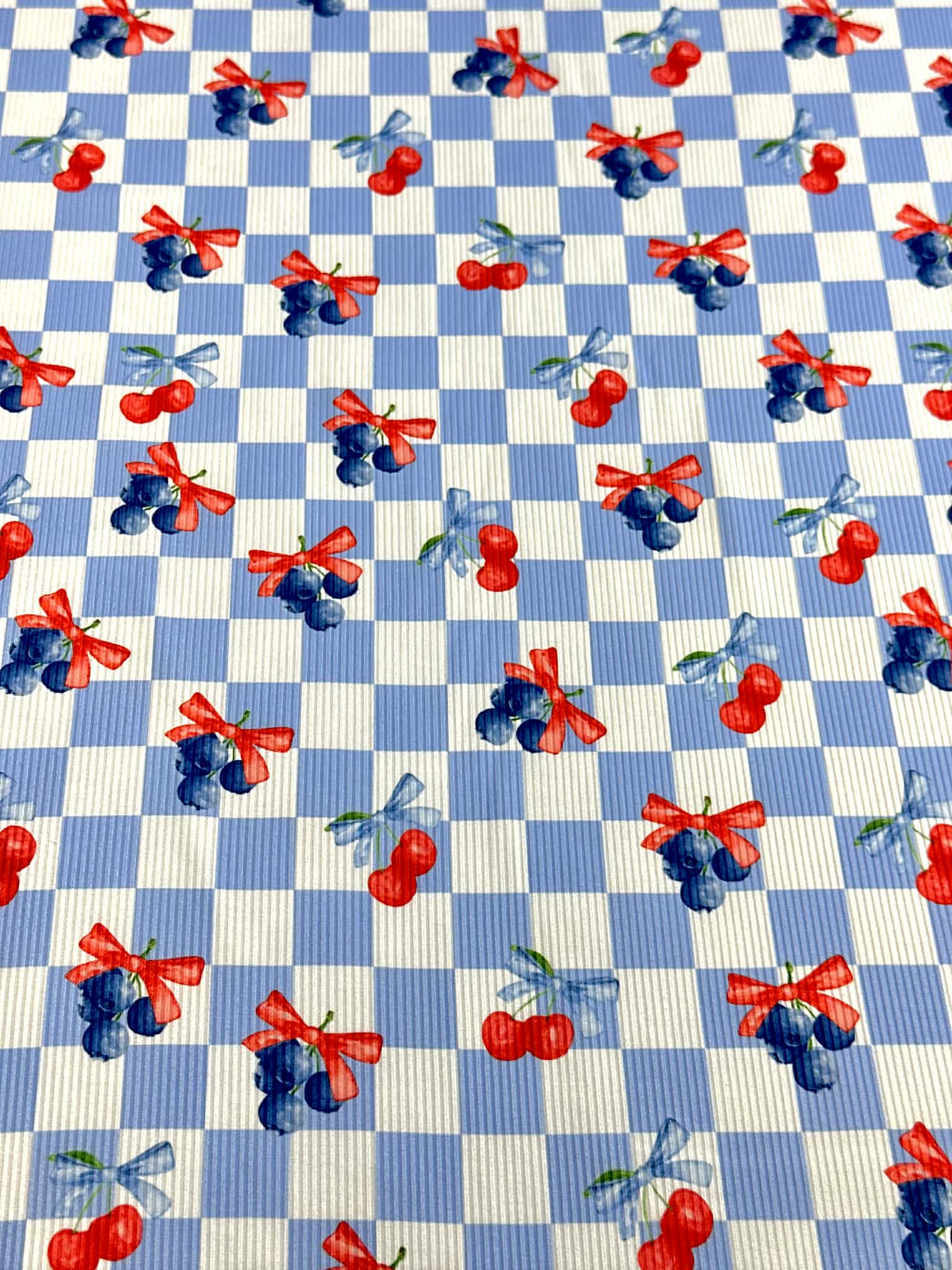 (2X2 YUMMY RIB) CHERRIES AND BLUEBERRIES WITH BOWS ON BLUE AND OFF WHITE CHECKERED