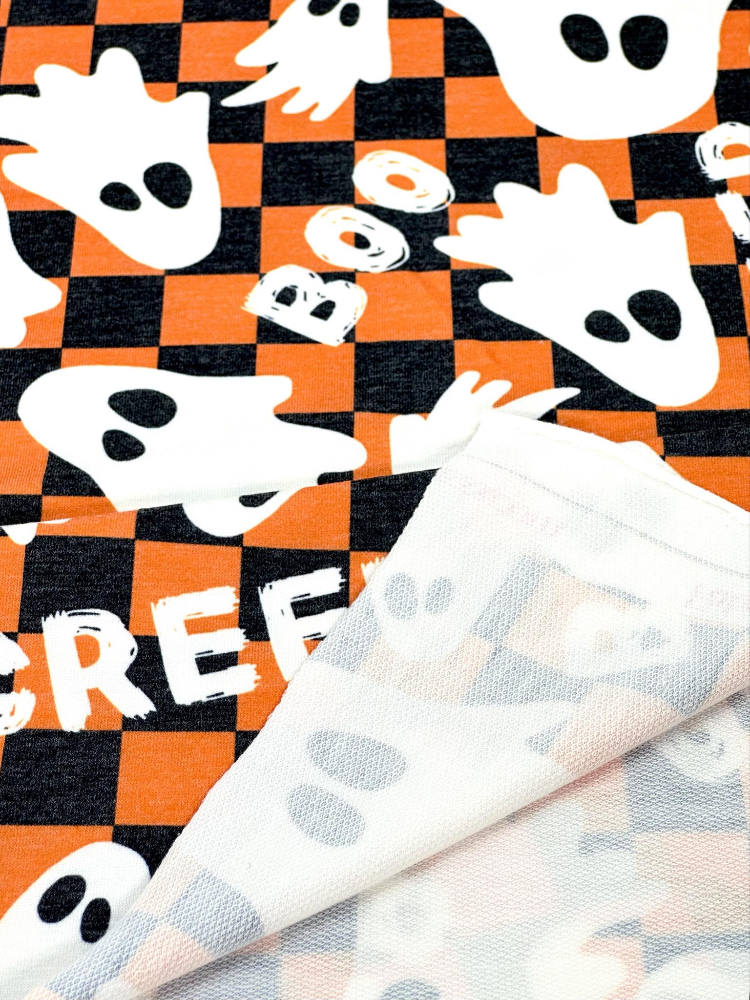 (FRENCH TERRY) GHOST ON ORANGE AND BLACK CHECKERED PRINT