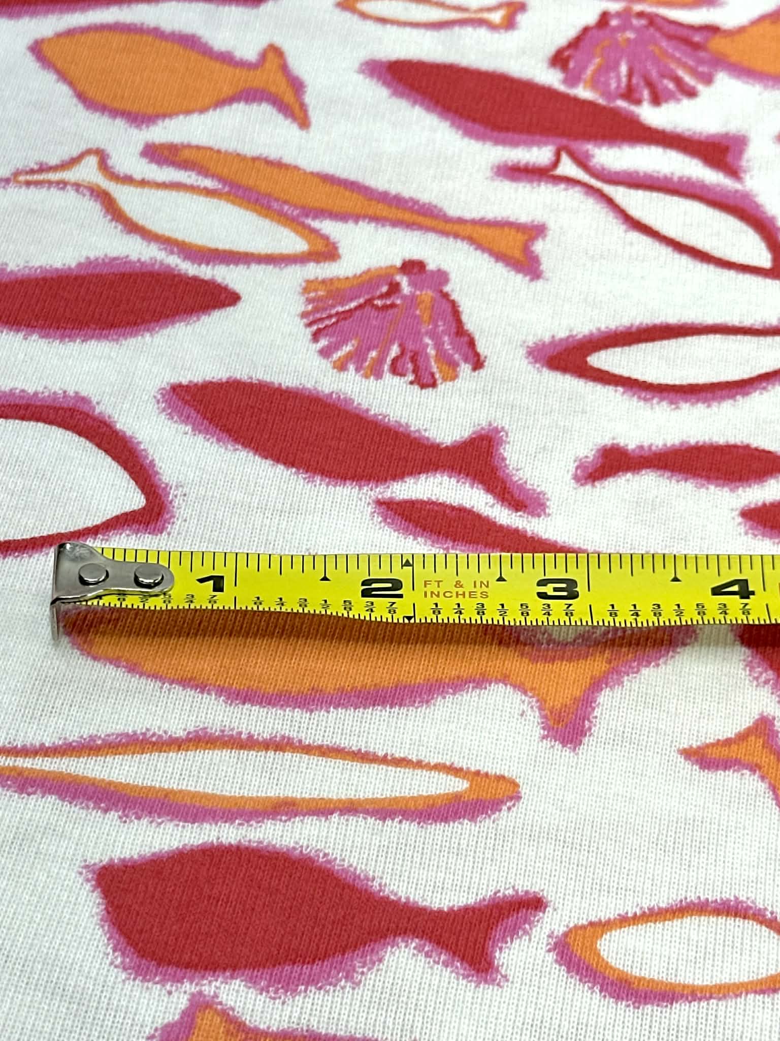 (COTTON BABY RIB) PINK, ORANGE AND RED FISH ON OFF WHITE