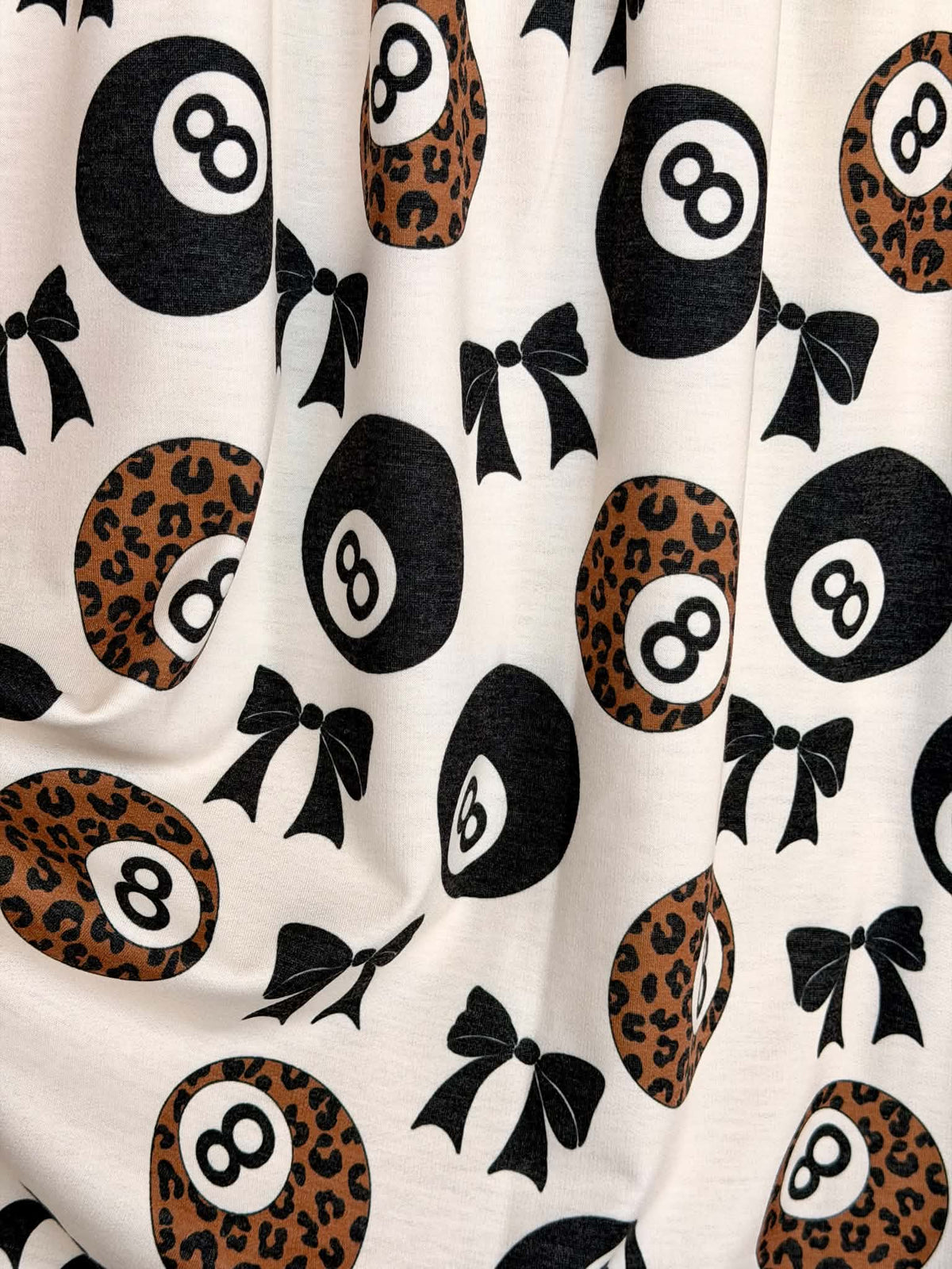 (FRENCH TERRY) BLACK BOW  AND LEOPARD 8-BALL PRINT ON CREAM