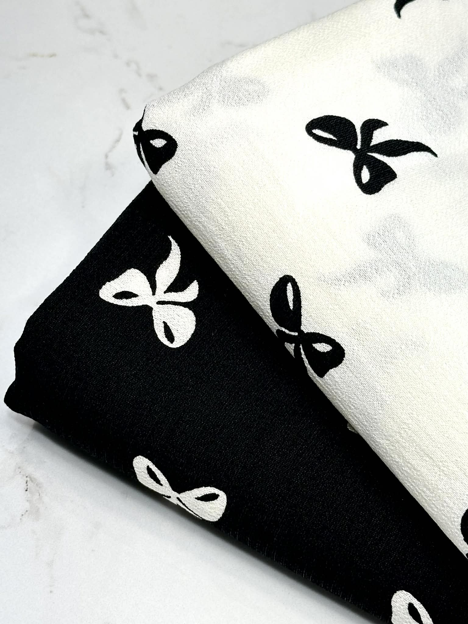 (WOVEN) BLACK BOWS ON OFF WHITE