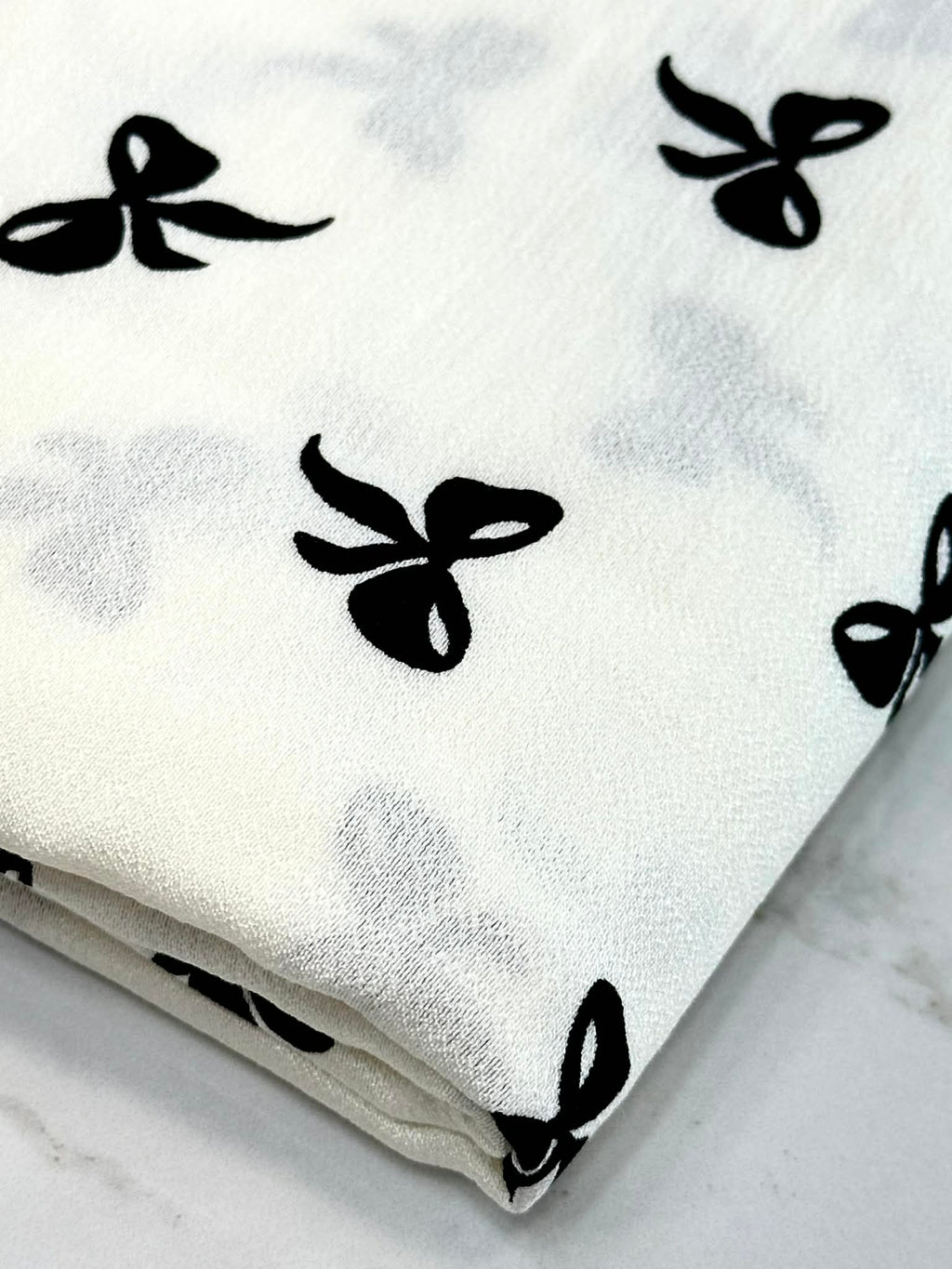 (WOVEN) BLACK BOWS ON OFF WHITE