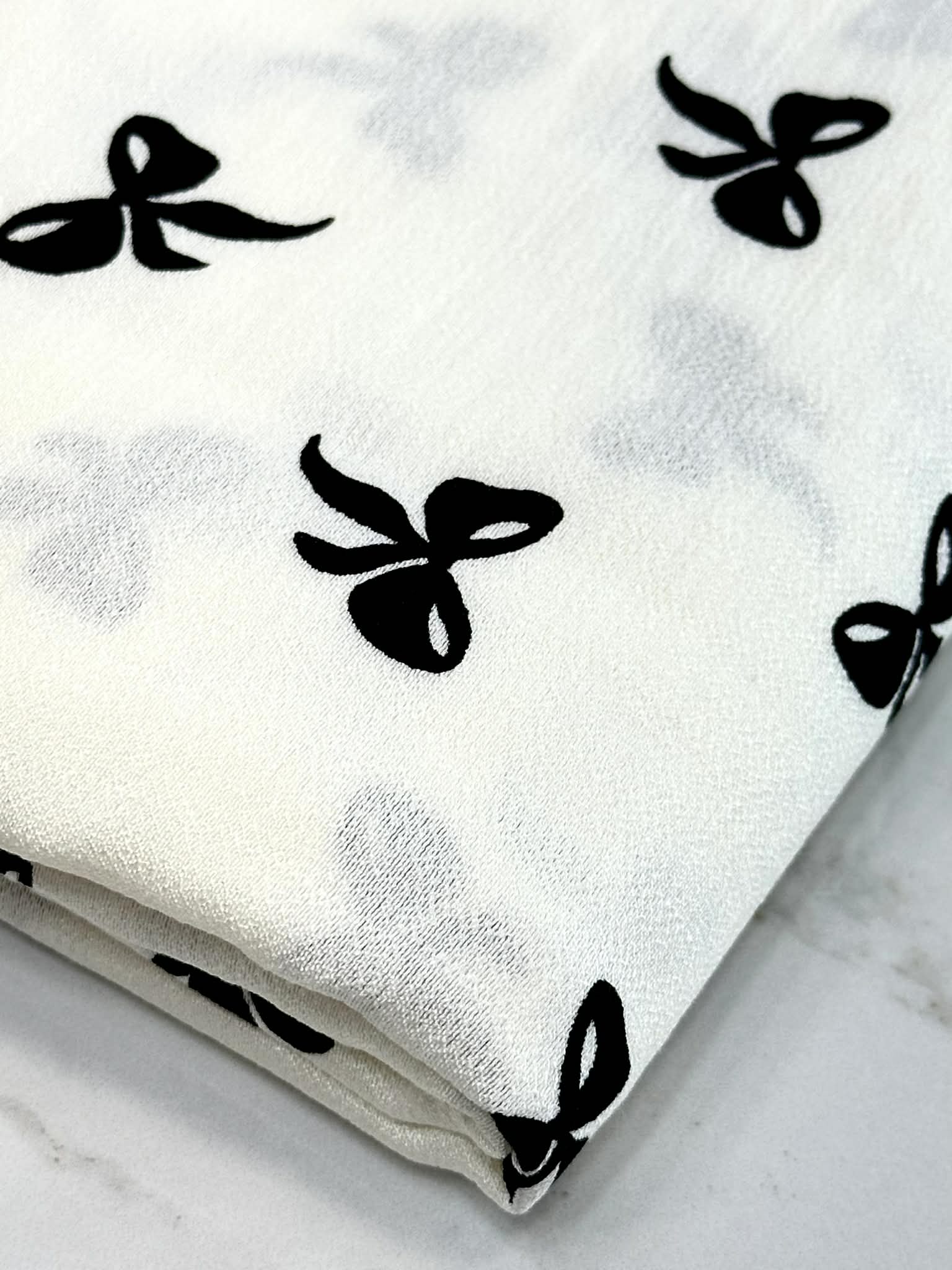 (WOVEN) BLACK BOWS ON OFF WHITE