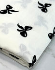 (WOVEN) BLACK BOWS ON OFF WHITE