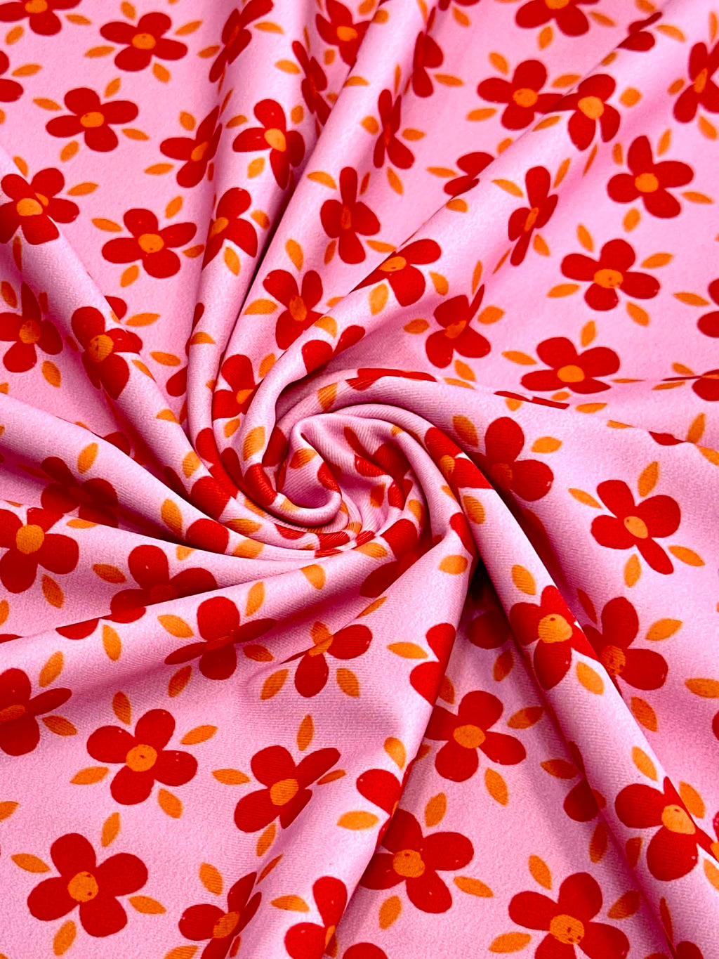 (SWIM) RED AND ORANGE FLOWERS ON PINK