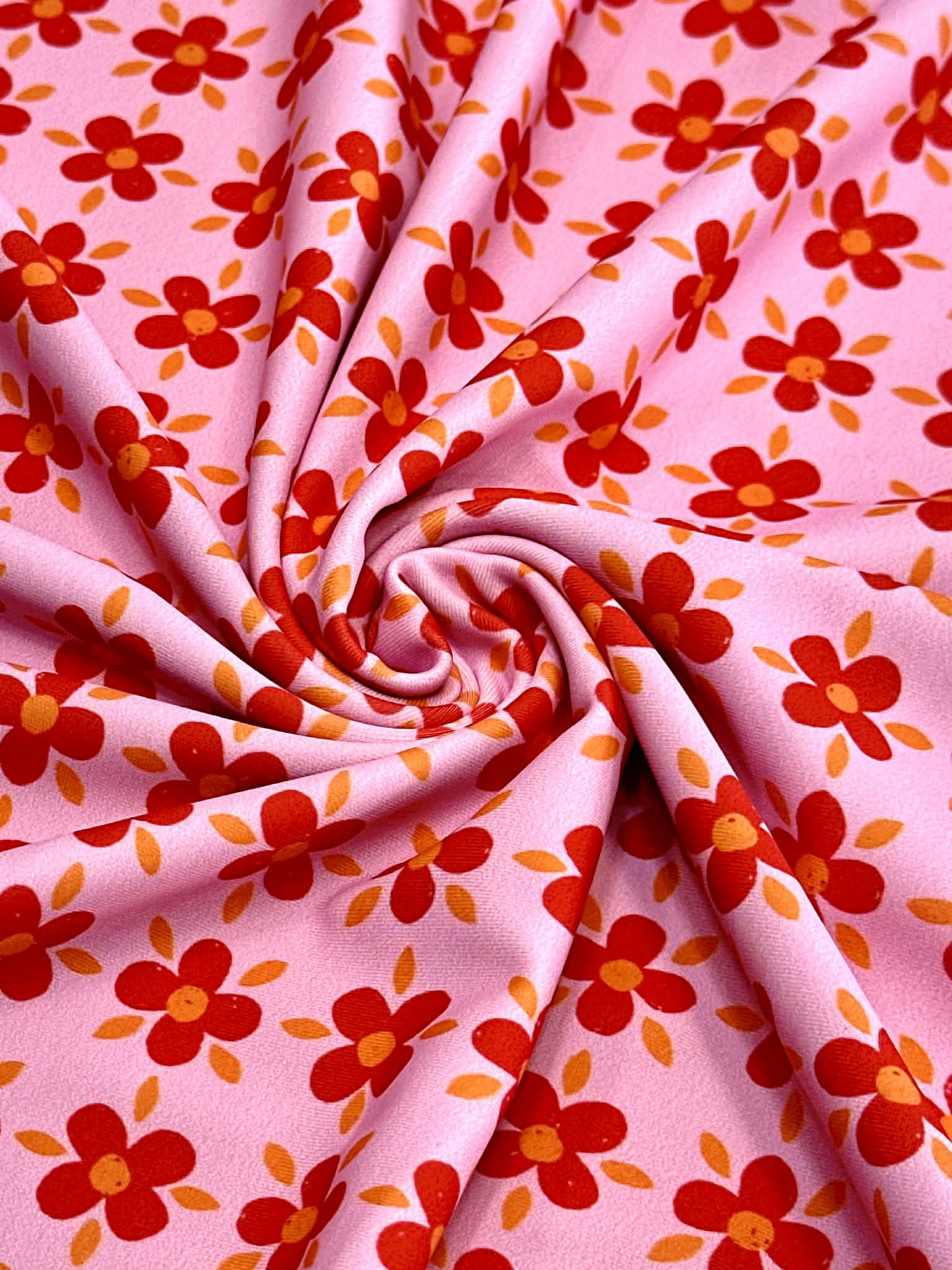 (SWIM) RED AND ORANGE FLOWERS ON PINK