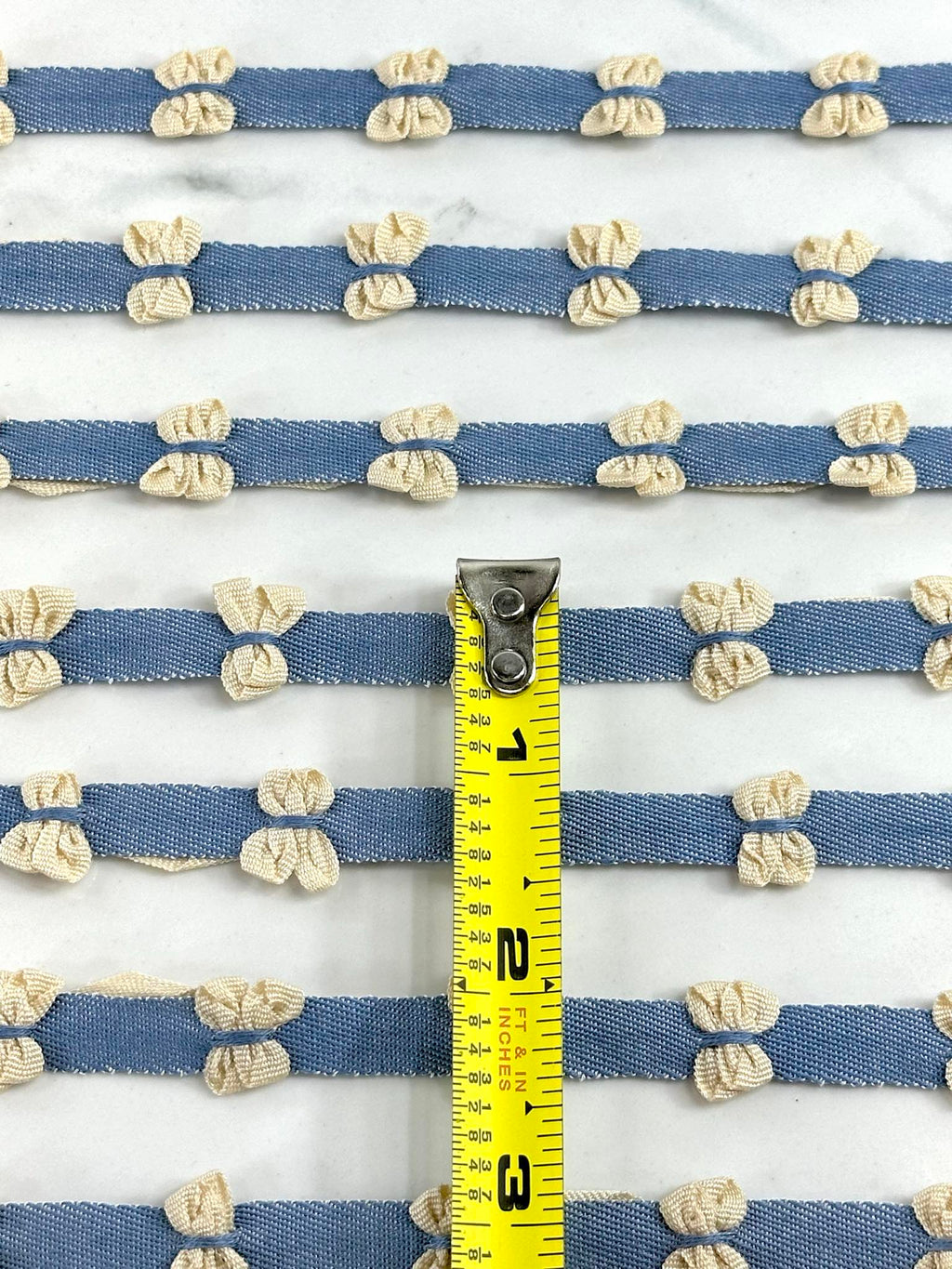 (TRIM) CREAM BOWS ON DENIM STRIP