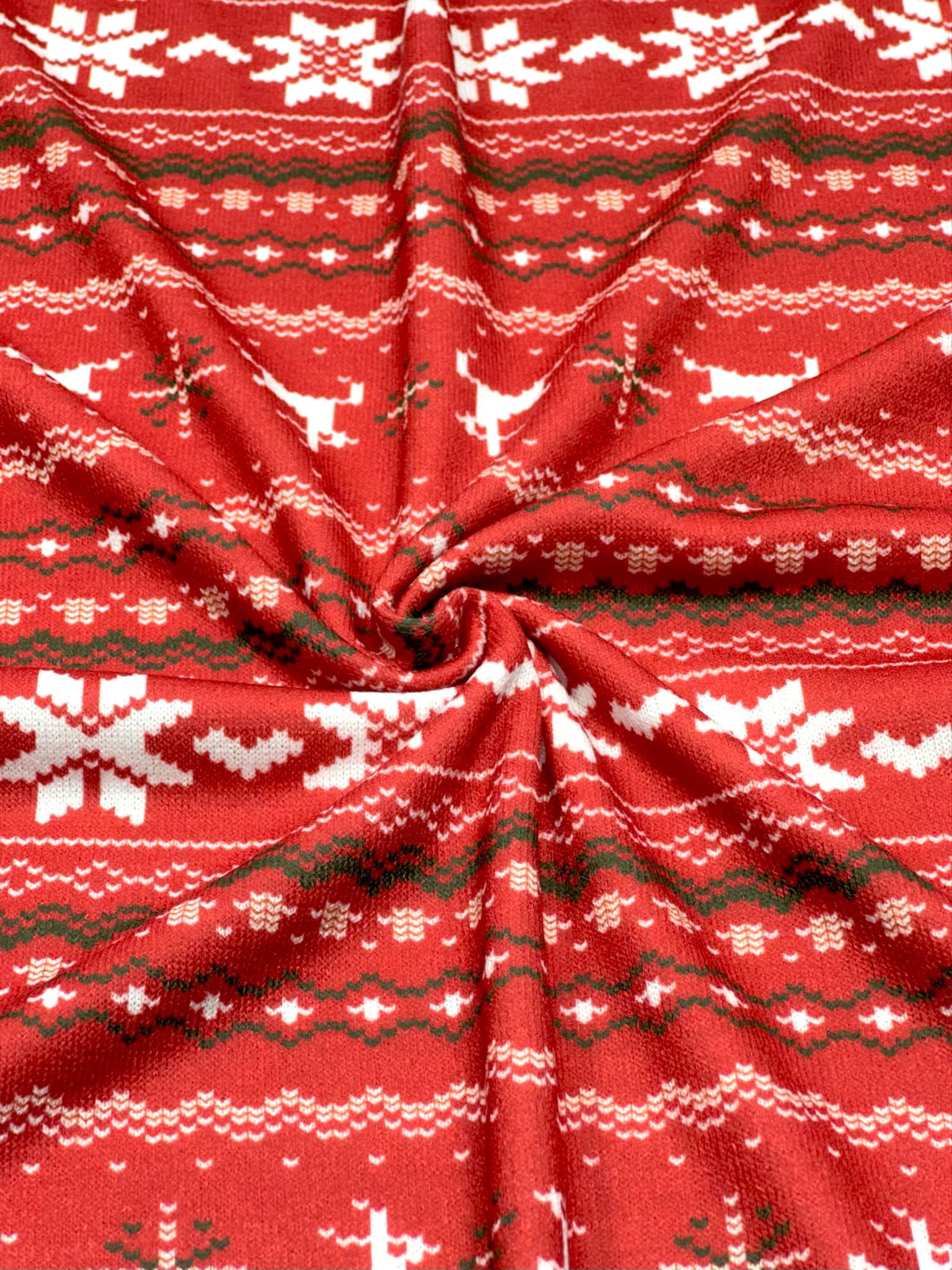 (SWEATER KNIT) OFF WHITE REINDEERS AND OFF WHITE POINSETTIA'S ON RED