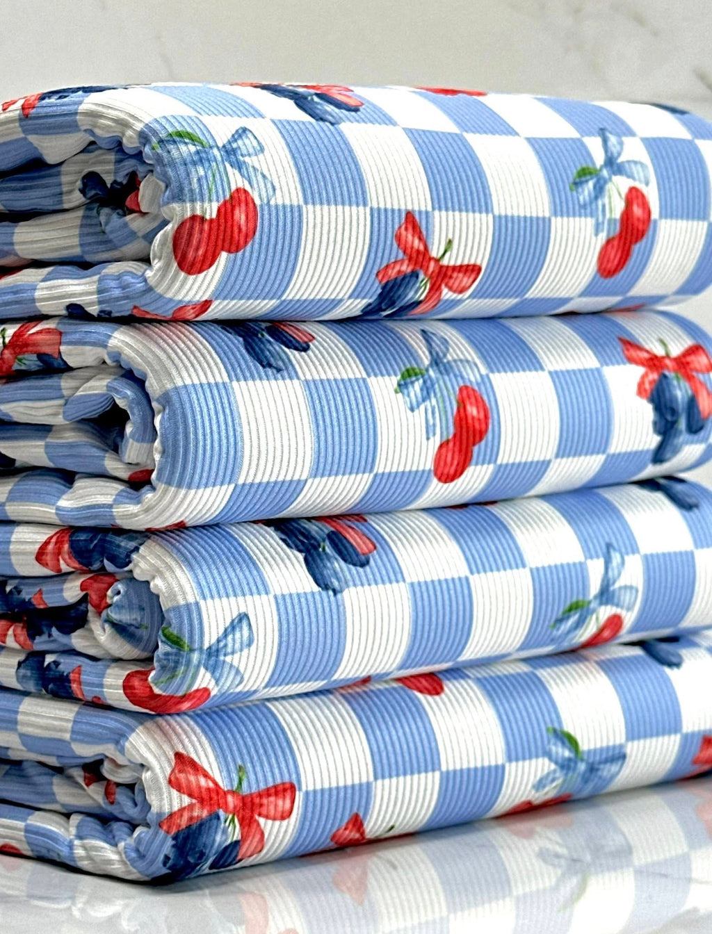 (2X2 YUMMY RIB) CHERRIES AND BLUEBERRIES WITH BOWS ON BLUE AND OFF WHITE CHECKERED