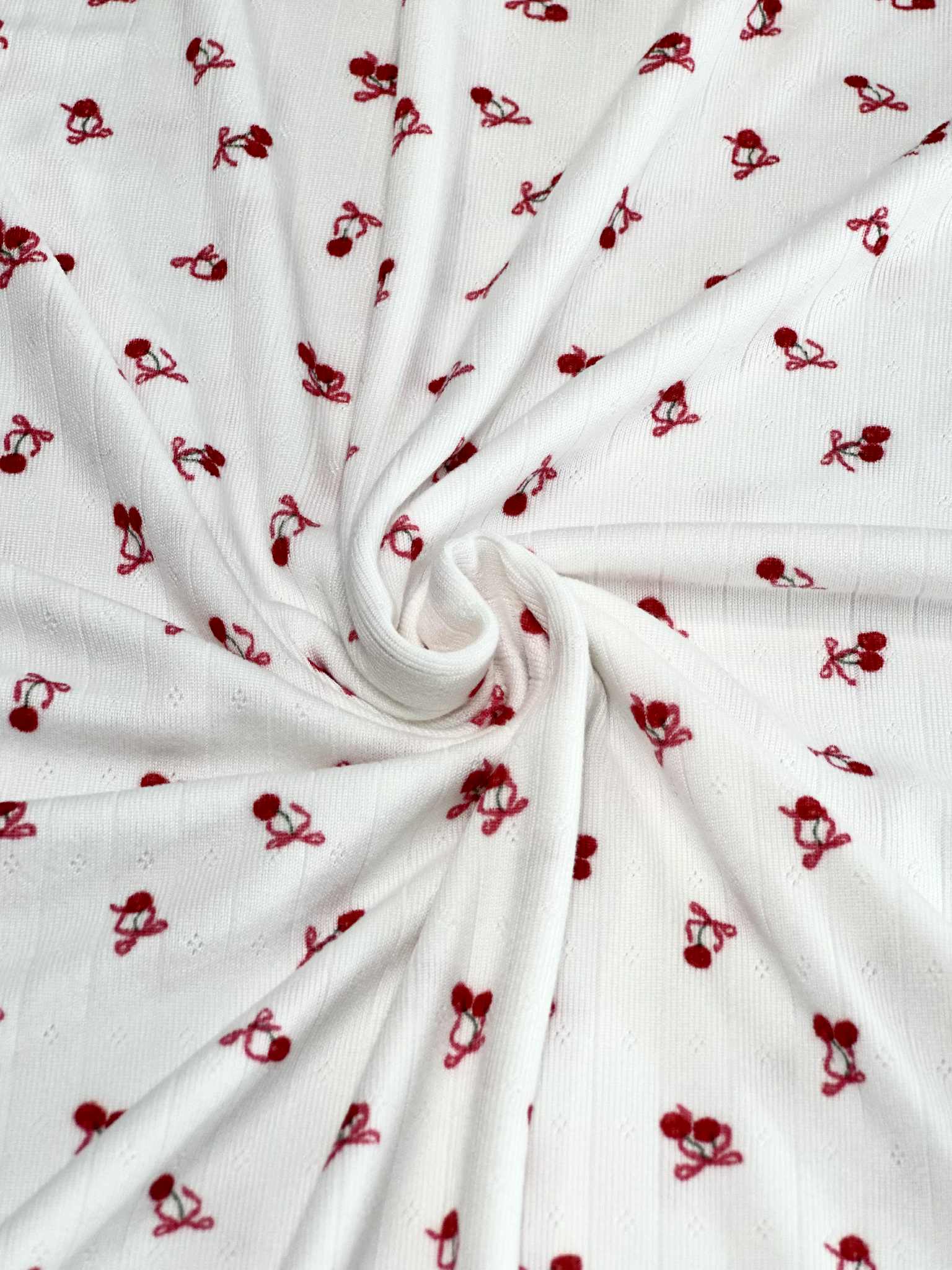 (POINTELLE RIB) TINY RED CHERRIES WITH BOWS ON OFF WHITE