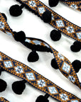 (TRIM) NAVY AND BLUE AZTEC PATTERN WITH BLACK POM POM BALL