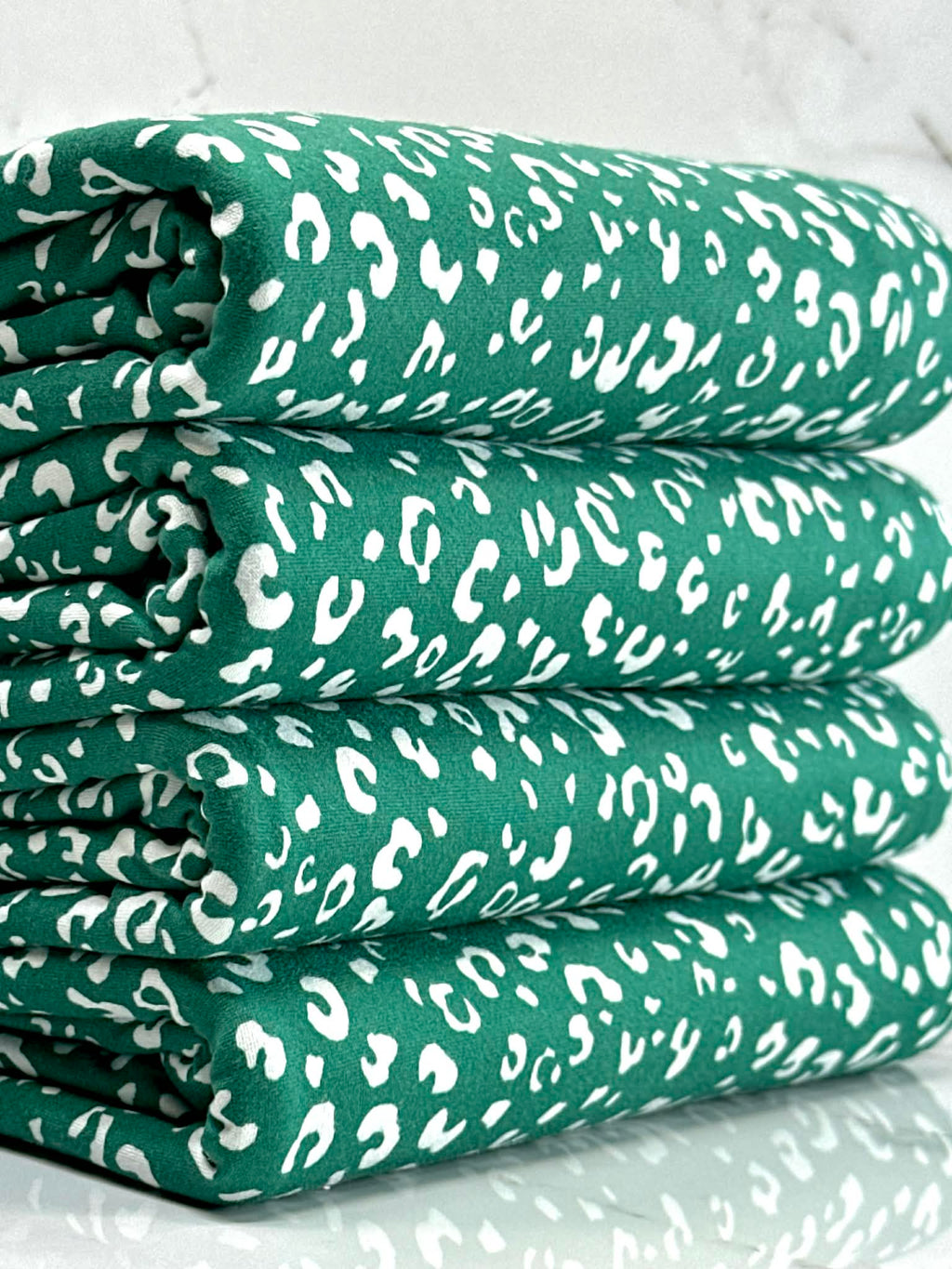 (DBP) TINY WHITE LEOPARD ON HUNTER GREEN