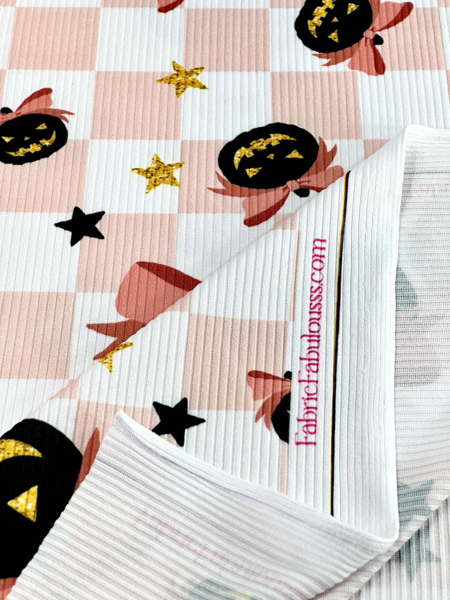 (YUMMY RIB) BLACK PUMPKINS WITH BOWS AND STARS ON LIGHT PINK CHECKERED