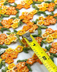 (TRIM) EMBROIDERED TANGERINE AND MUSTARD FLOWERS