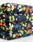 (HACCI SWEATER KNIT) ORANGE, GREEN, TEAL AND OFF WHITE LEOPARD ON NAVY