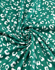 (DBP) TINY WHITE LEOPARD ON HUNTER GREEN