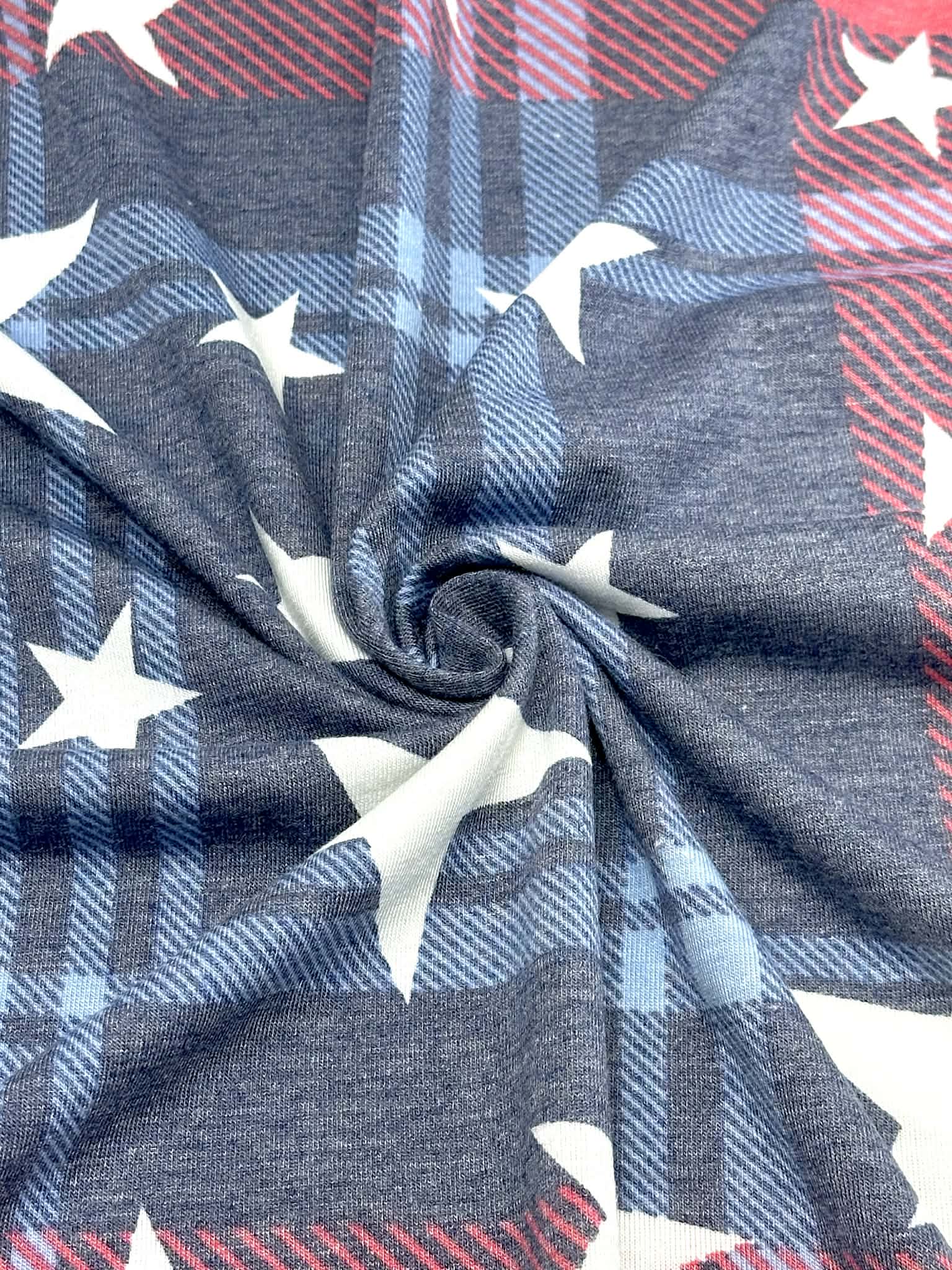 (KNIT) OFF WHITE STARS ON NAVY AND RED PLAID