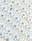 (TRIM) EMBROIDERED WHITE FLOWERS WITH LIGHT BLUE