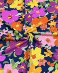 (SWEATER KNIT) PURPLE, ORANGE, YELLOW AND PINK FLOWERS ON NAVY