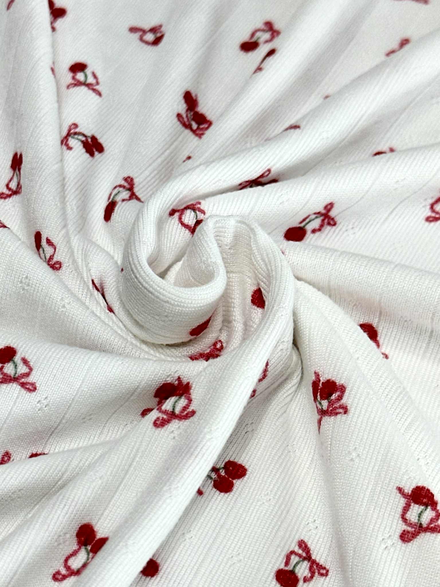 (POINTELLE RIB) TINY RED CHERRIES WITH BOWS ON OFF WHITE