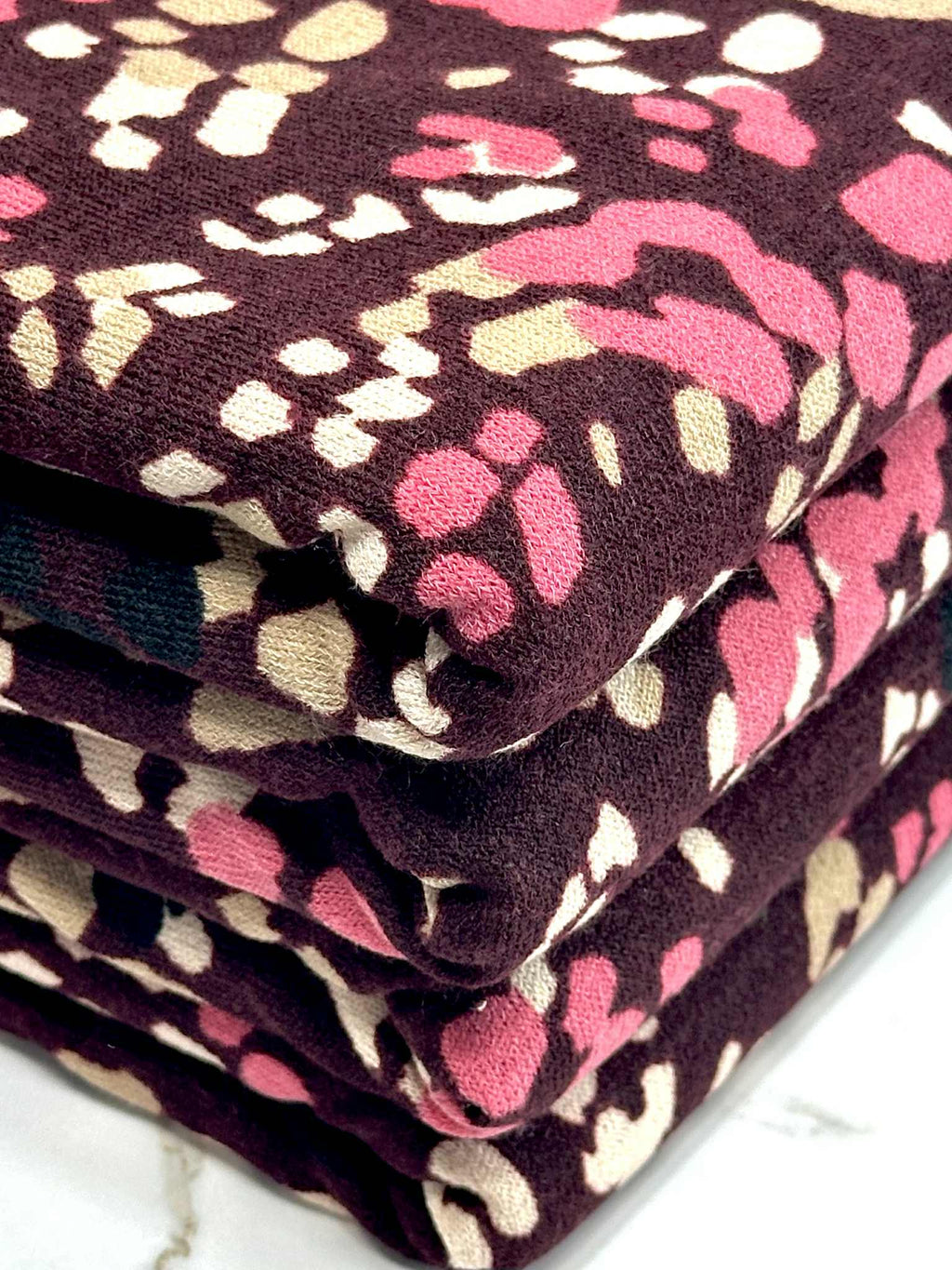 (HACCI SWEATER KNIT) PINK, IVORY, AND BLACK LEOPARD ON BURGUNDY