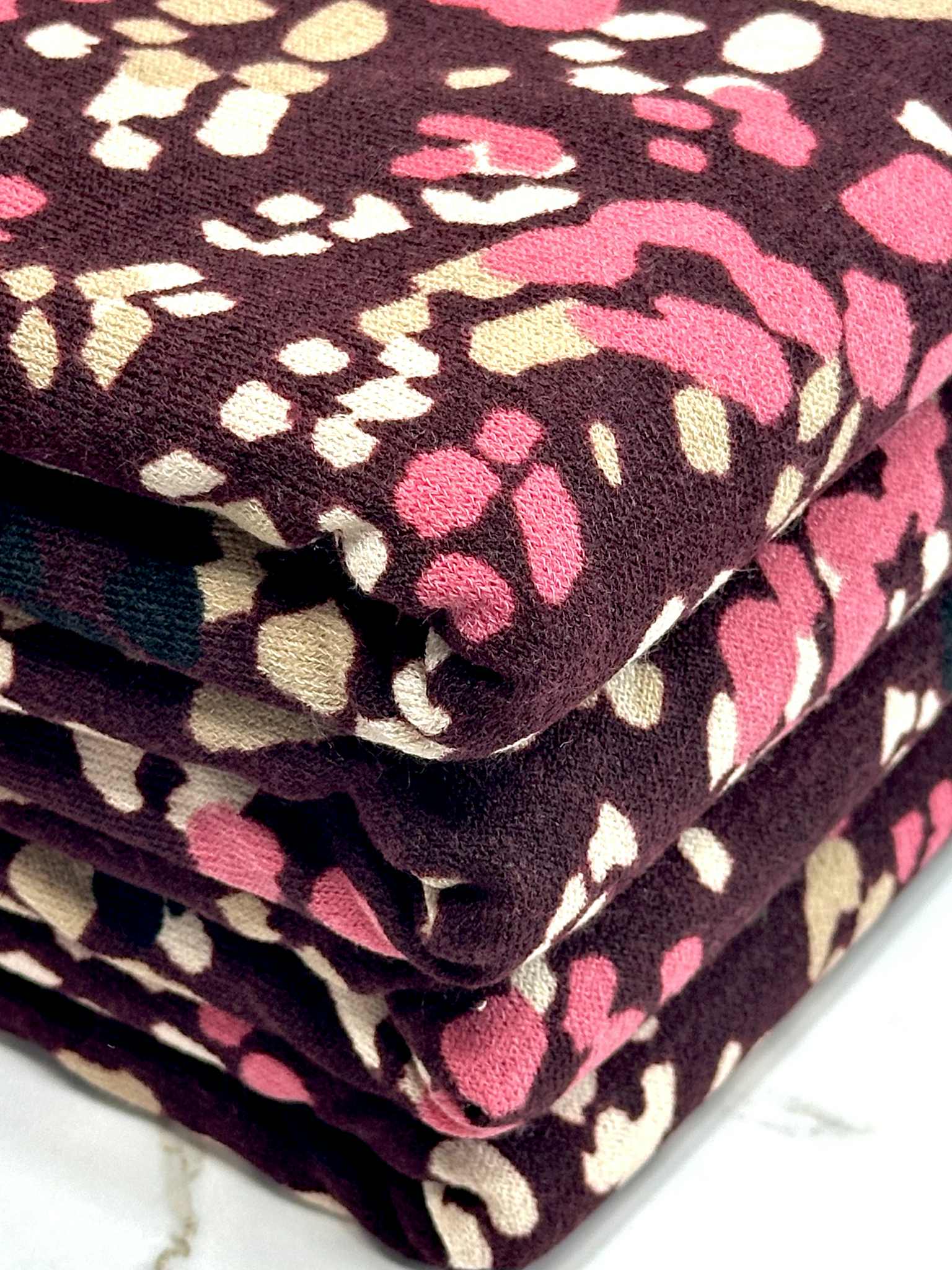 (HACCI SWEATER KNIT) PINK, IVORY, AND BLACK LEOPARD ON BURGUNDY