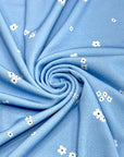 (CREPE KNIT) TINY WHITE FLOWERS ON BLUE