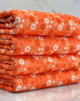 (2X2 YUMMY RIB) BURNT ORANGE AND OFF WHITE TINY FLOWERS ON ORANGE