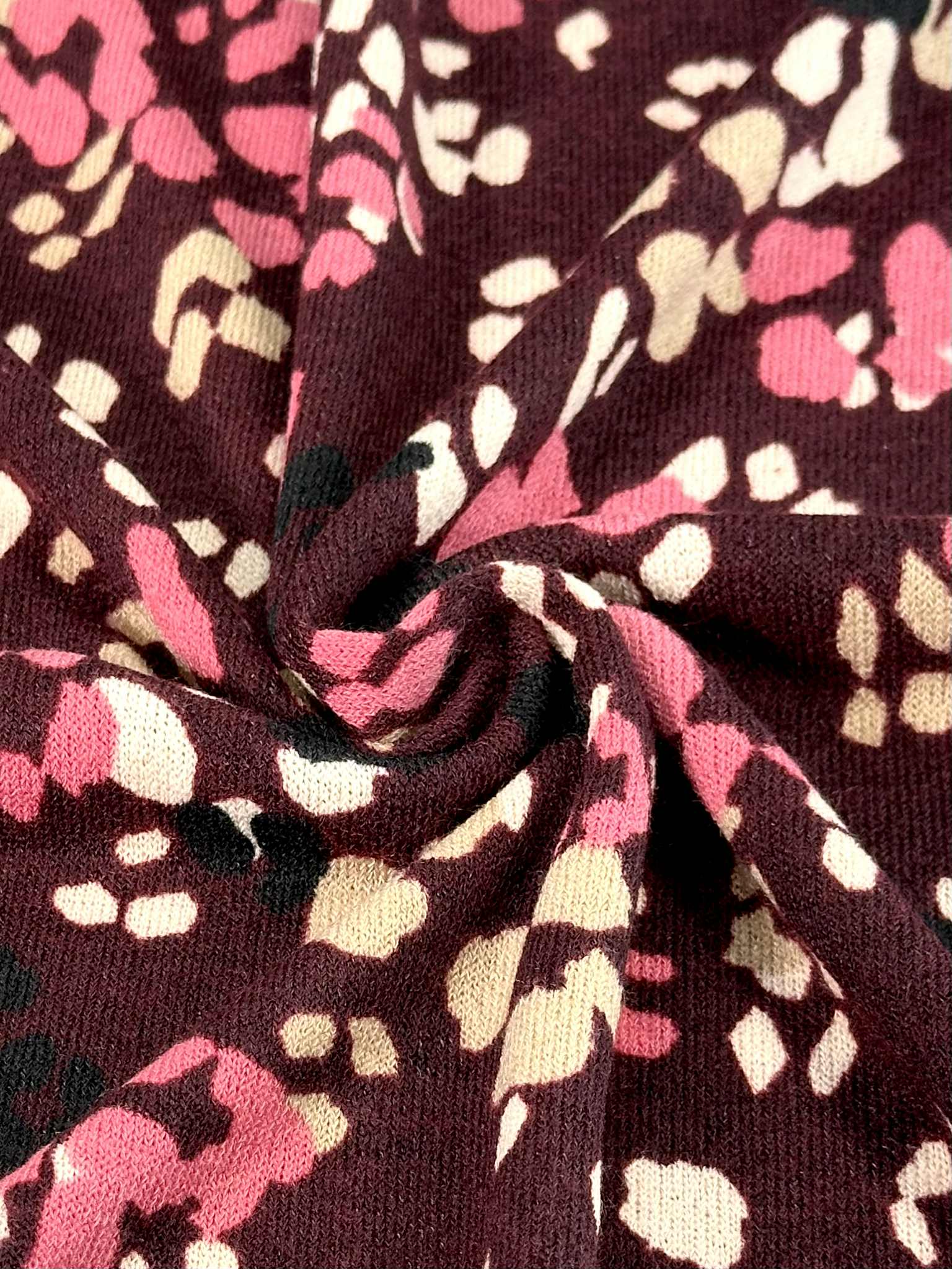 (HACCI SWEATER KNIT) PINK, IVORY, AND BLACK LEOPARD ON BURGUNDY