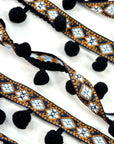 (TRIM) NAVY AND BLUE AZTEC PATTERN WITH BLACK POM POM BALL