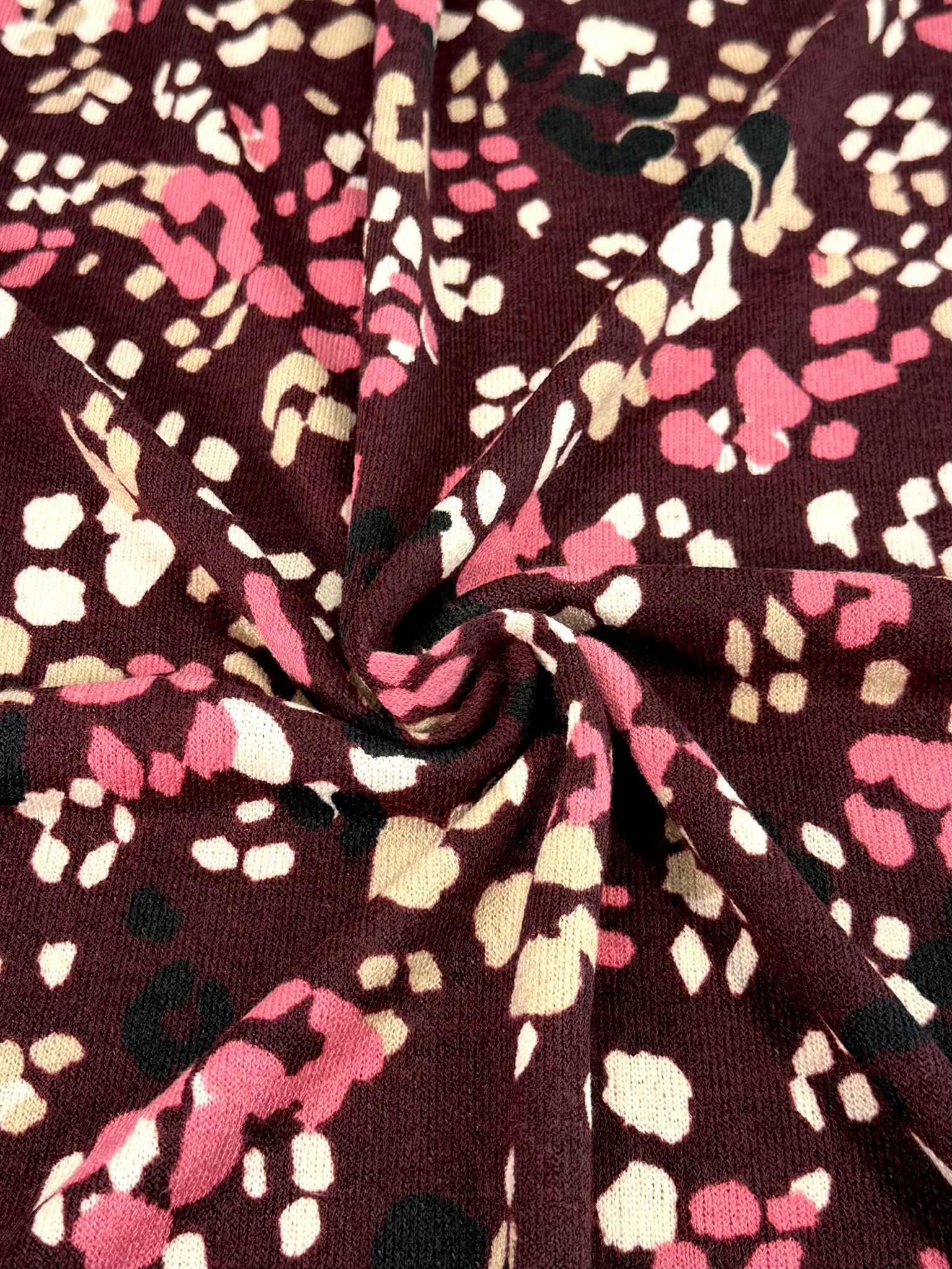 (HACCI SWEATER KNIT) PINK, IVORY, AND BLACK LEOPARD ON BURGUNDY