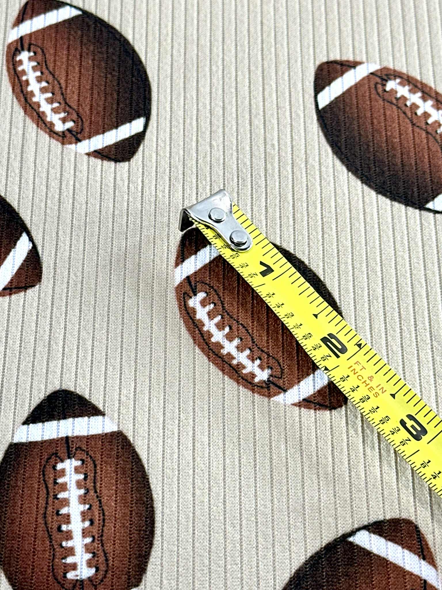 (4X2 RIB) FOOTBALLS ON TAN
